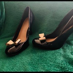 Lauren Conrad black 4 inch heel with gold bow.